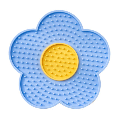 The Calm Lick Mat suction slow feeder in blue, flower shaped