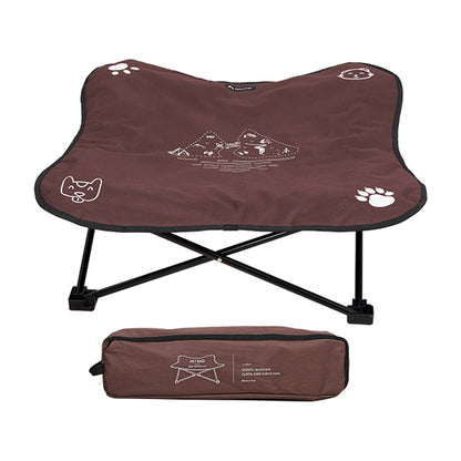 The Camp Bed raised folding dog cot in brown, with its carry bag