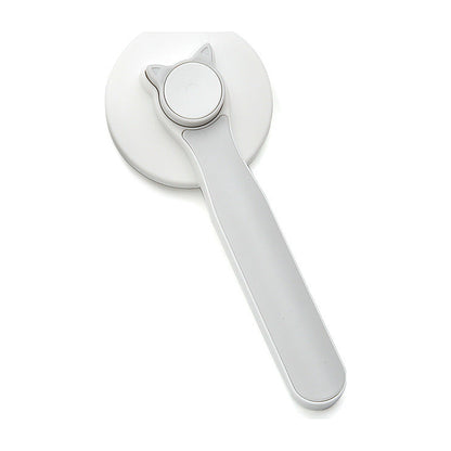 The Coat Brush self-cleaning slicker with a grey handle, seen from the front