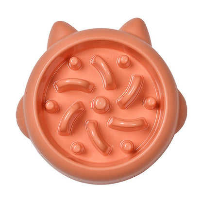 The Slow Bowl in coral beside the teal version filled with kibble