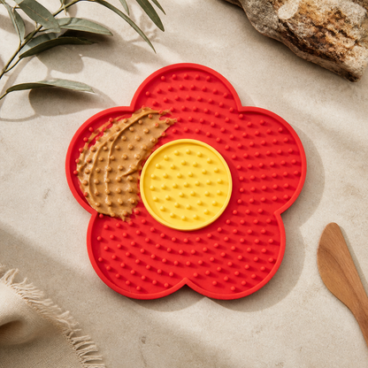 Flower-shaped calm lick mat on pale limestone