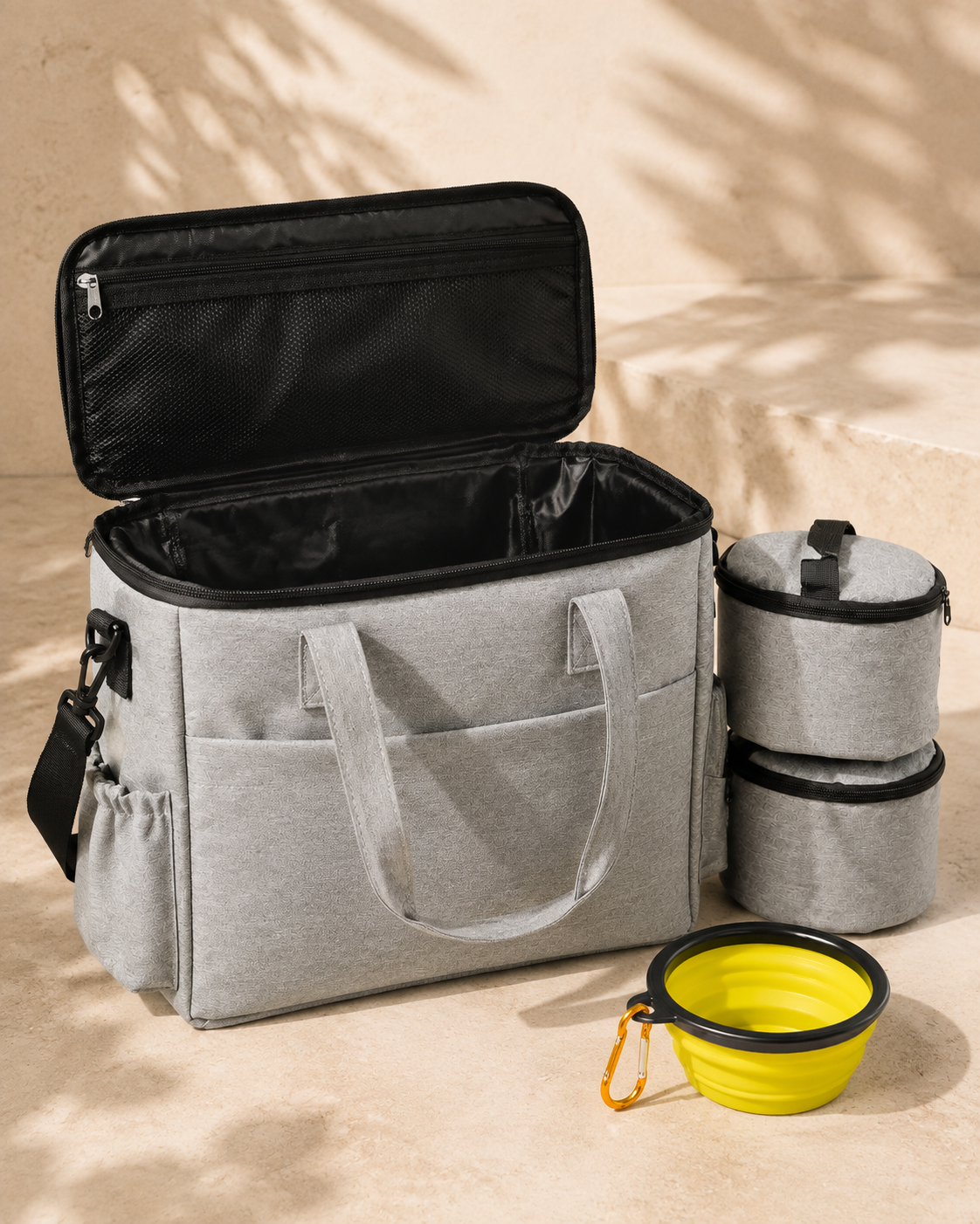 Weekender Food Bag open with insulated interior, two food containers and one yellow collapsible bowl